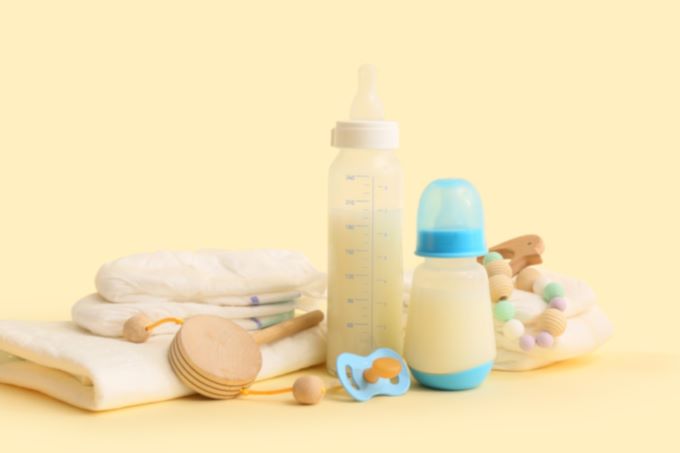 a photo with diapers, bottles and other baby care items