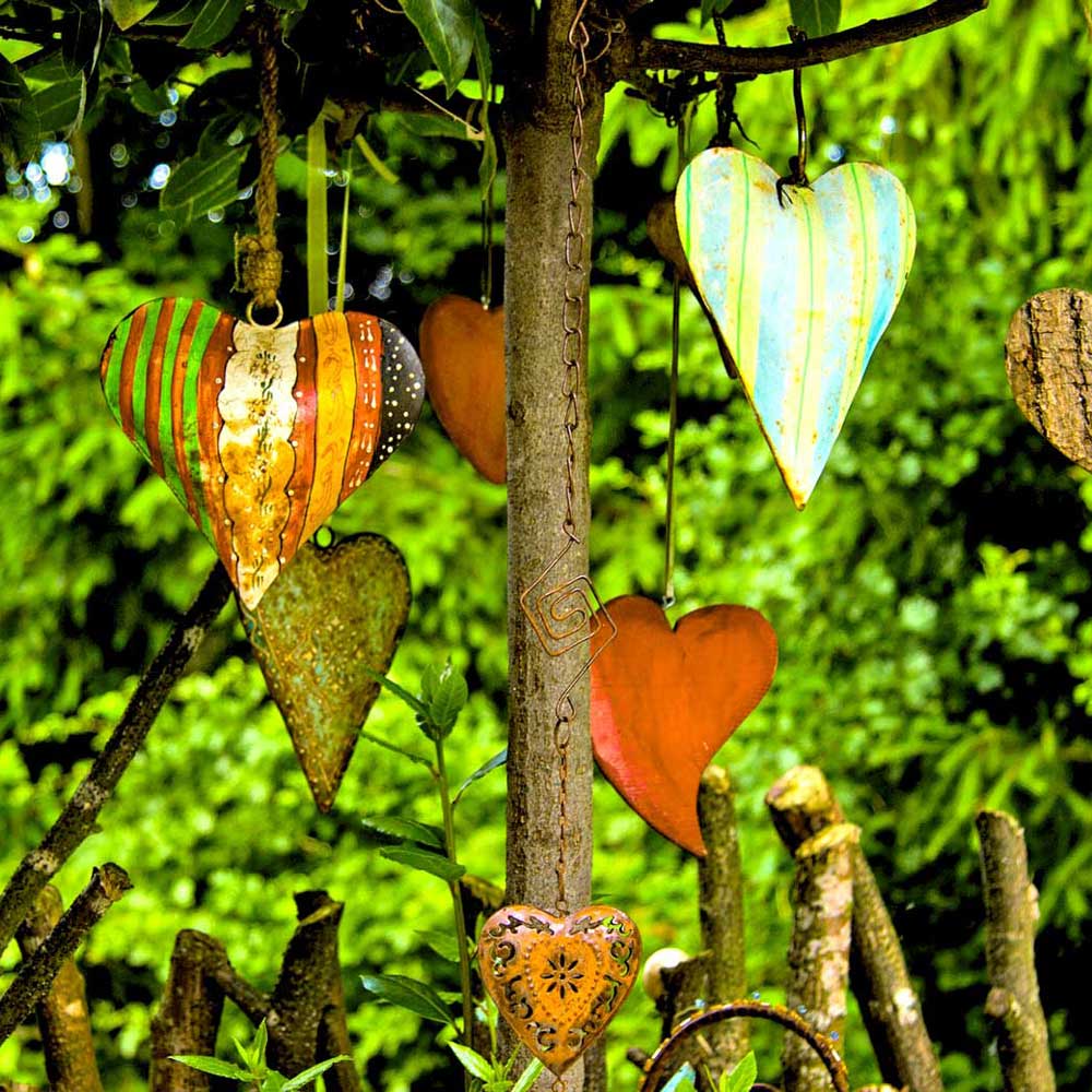 An image of a tree with branches and heart-shaped ornaments hanging from the branches